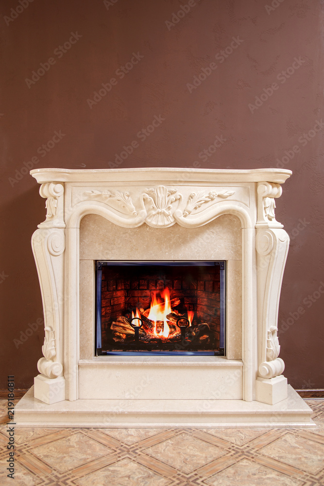 Fototapeta premium Granite marble fireplaces in the interior with handmade decor elements