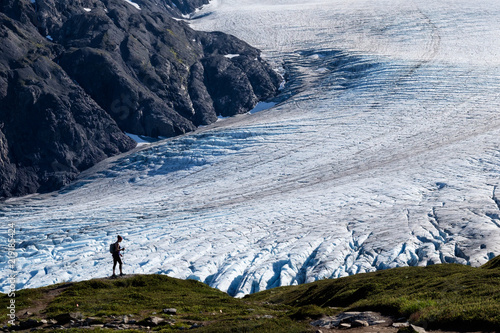 A hiker travelling up the trail along the Exit Glacier near Seward, Alaska.