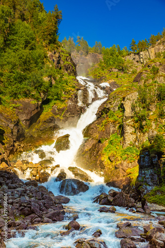 Waterfall Latefossen at sunset lights in summer in Norway