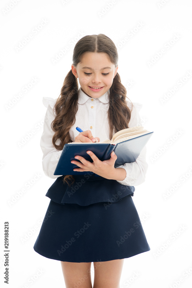 Schoolgirl write daily schedule notepad isolated on white. Little child hold textbook with pen. Plan for week. Home schooling education. Adorable bookworm planning her studying schedule for week Schoolgirl write daily schedule notepad isolated on white. Little child hold textbook with pen. Plan for week. Home schooling education. Adorable bookworm planning her studying schedule for week