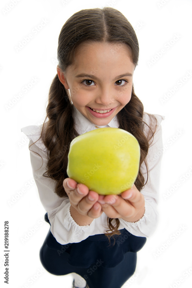 Child girl school uniform clothes offers apple. Child smart kid smiling face choose healthy snack. School lunch snack concept. Healthy nutrition. Girl cute pupil holds apple fruit white background Child girl school uniform clothes offers apple. Child smart kid smiling face choose healthy snack. School lunch snack concept. Healthy nutrition. Girl cute pupil holds apple fruit white background