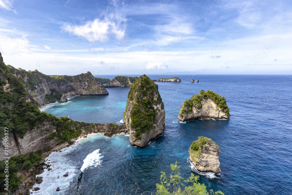 View of the small islands of Nusa Batumategan and Nusa Batupadasan from the Raja Lima shrine on Nusa Penida Island near Bali, Indonesia.