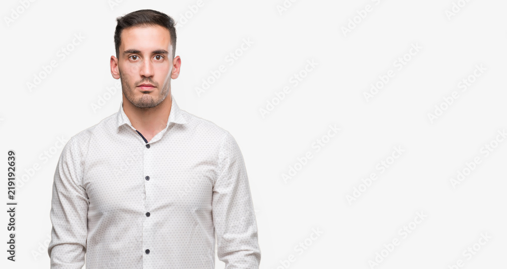 Handsome young business man with a confident expression on smart face thinking serious Handsome young business man with a confident expression on smart face thinking serious