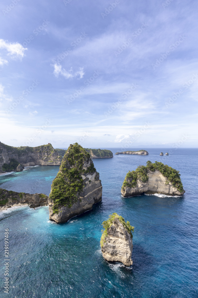 Raja Lima or Five Kings, islands off the coast of Nusa Penida near Atuh Beach.