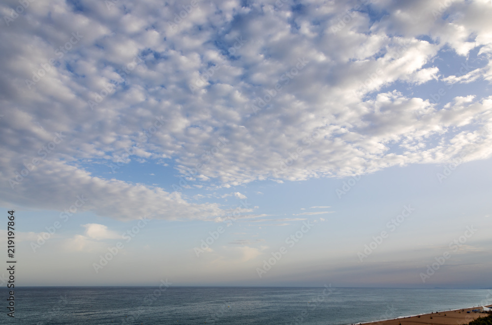 Sea beach in Costa Brava with clouds, Spain
