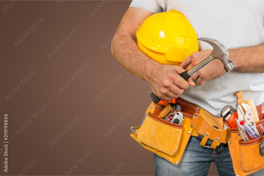 Worker with a tool belt. Isolated over background. Worker with a tool belt. Isolated over background.