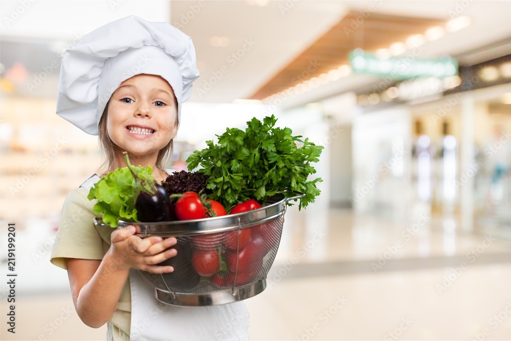 Portrait of adorable little girl preparing healthy food at Portrait of adorable little girl preparing healthy food at