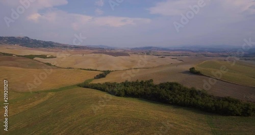 Aerial, gorgeous tuscan fields landscape near the city of Volterra photo