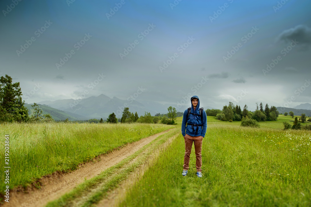 Traveler Man with backpack mountaineering Traveler Man with backpack mountaineering