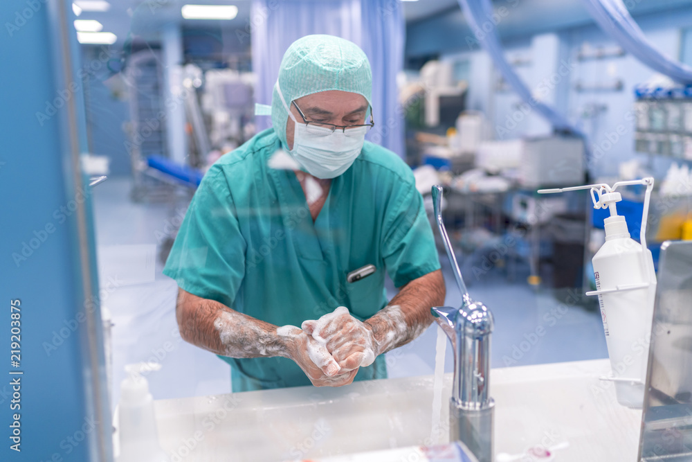 Surgeon washing his hands