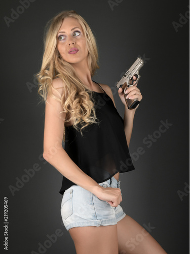 Beautiful sexy girl with gun