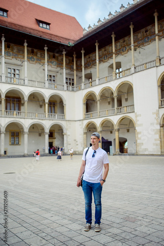 Man during sightseeing old castle in Cracow, Wawel. © Andrzej Wilusz