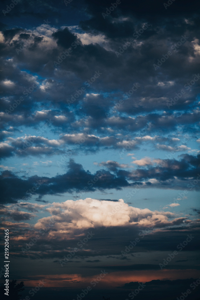 Obraz premium amazing view of sunset sky with clouds, vertical image of sunset or sunrise . beautiful landscape