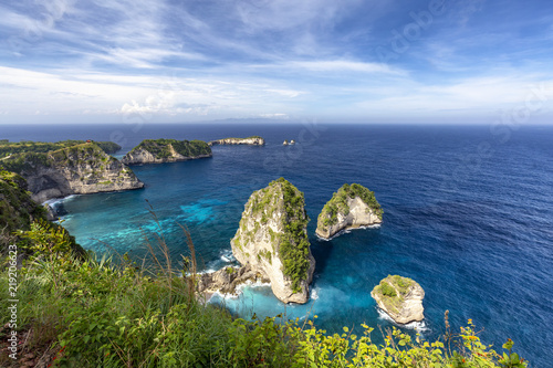 Beautiful wide angle landscape view of Raja Lima islands near Atuh Beach in Nusa Penida. photo