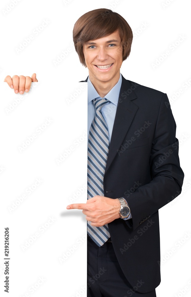 Young male in business suit with invisible object Young male in business suit with invisible object