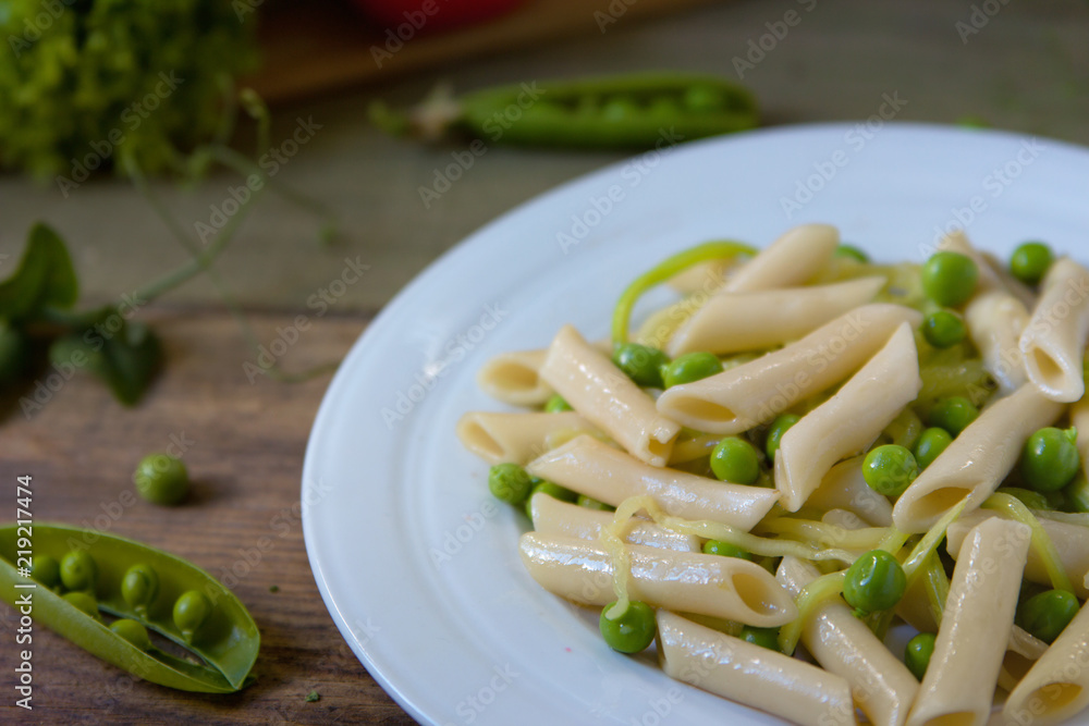 Penne pasta with green peas, zucchini noodle and herbs Penne pasta with green peas, zucchini noodle and herbs
