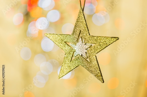 Christmas Star with Blurred Lights on Background