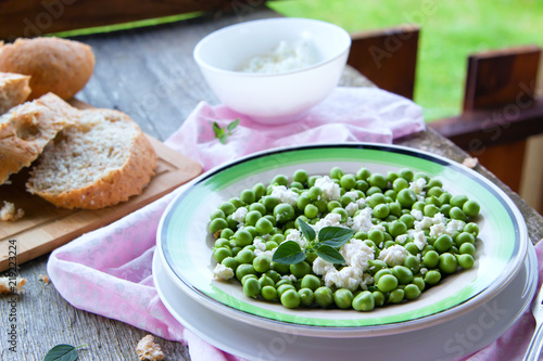 Fresh salad of green peas, goat cheese and herbs.