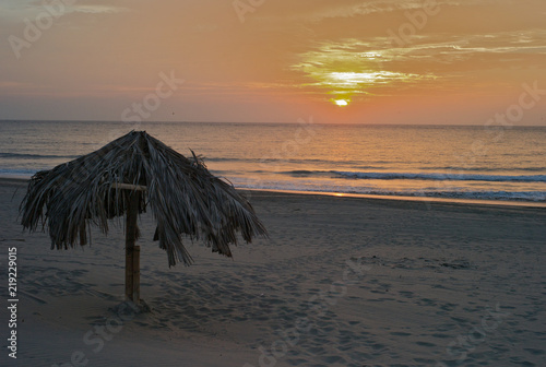 Sundown on the Beach with Parasol Umbrella, Vichayito Beach, Peru photo