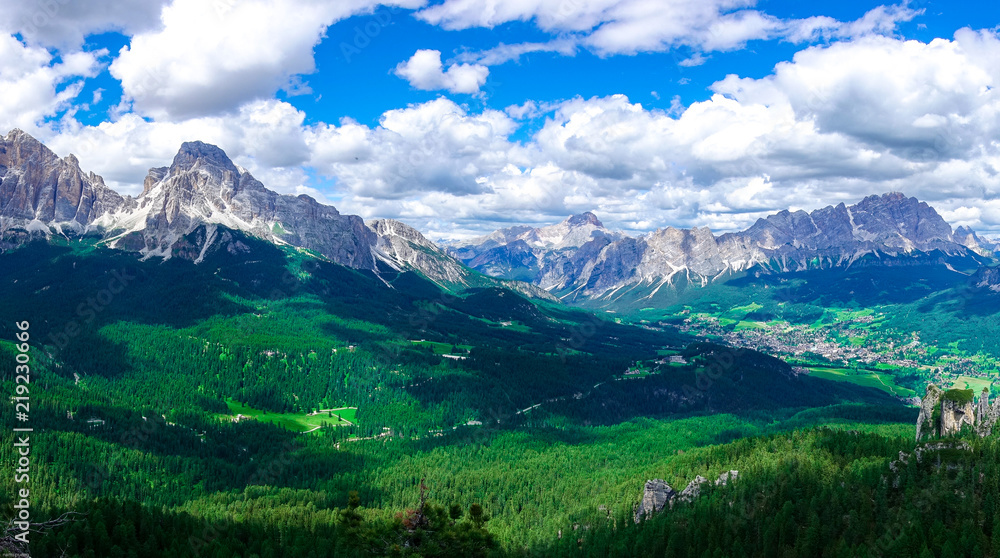 The panorama view of green hill with Passo Pordoi peak, South Tyrol, Dolomites, Italy.