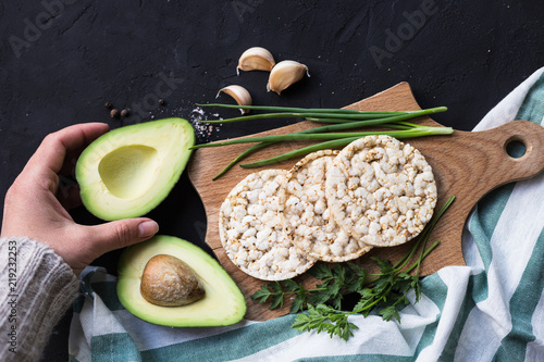 Vegan breakfast rice tortillas avocado tomato spices onions photo