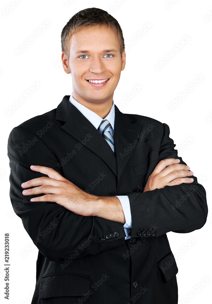Professional looking man with his arms crossed wearing a suit Professional looking man with his arms crossed wearing a suit
