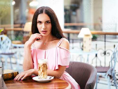 young woman rest in cafe after shopping photo