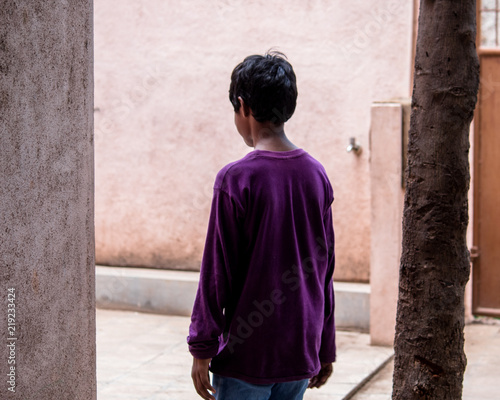 Boy staring into wall © Shiv Mer