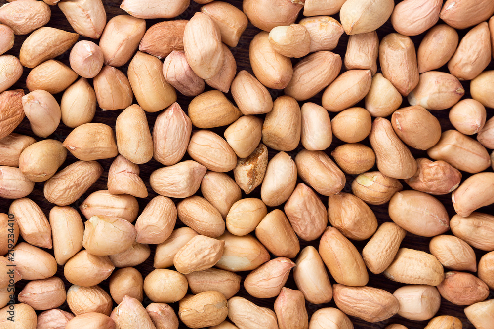 close up peanuts on background. top view close up peanuts on background. top view