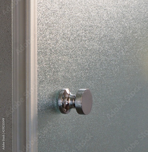 Brilliant, polished door handle for glass shower cubicle