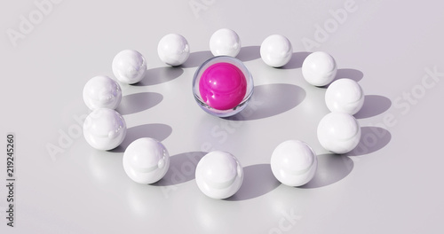 Symbol for the leadership by a woman. Pink ball as a symbol of a leader in the center of a group.