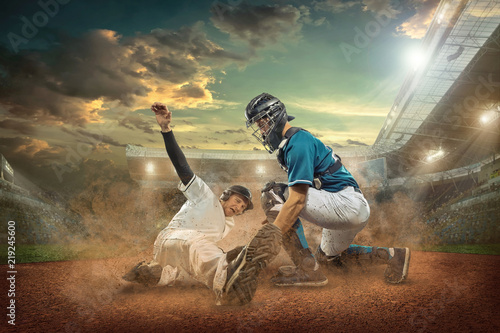 Photography Baseball players in action on the stadium.