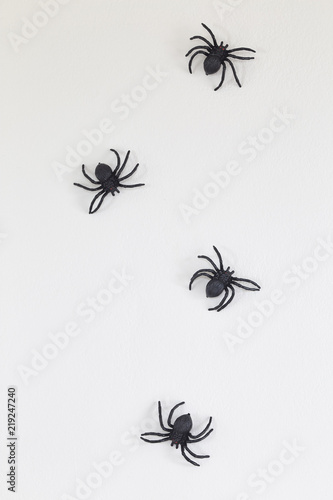 Halloween black spiders on wall © 1981 Rustic Studio