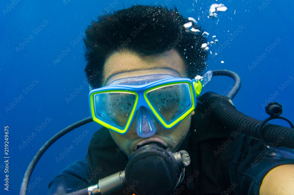 Scuba diving man with mask and underwater wetsuit take selfies photo Scuba diving man with mask and underwater wetsuit take selfies photo