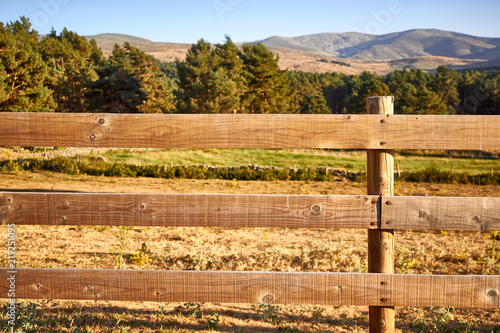 Wood fence on a countryside background