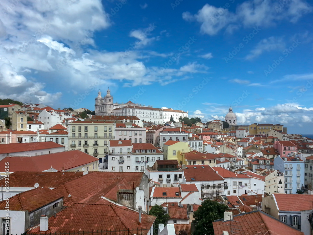 Panorama view over the city of lisbon with church and castle in background
