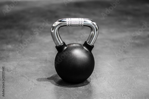 Fototapeta Naklejka Na Ścianę i Meble -  health and sport lifestyle concept, steel athletic kettlebell weight in a black shell