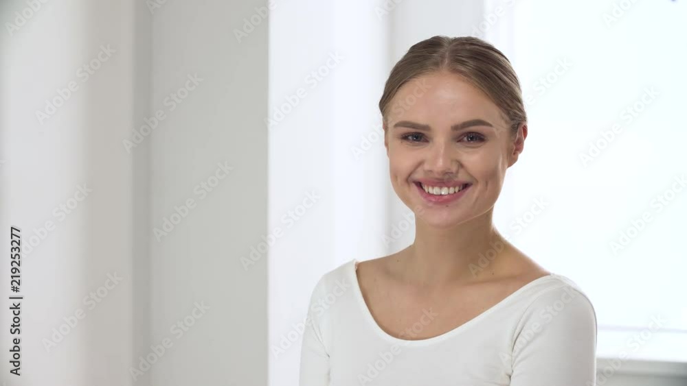Portrait Of Happy Woman With Natural Beauty In White Interior Portrait Of Happy Woman With Natural Beauty In White Interior
