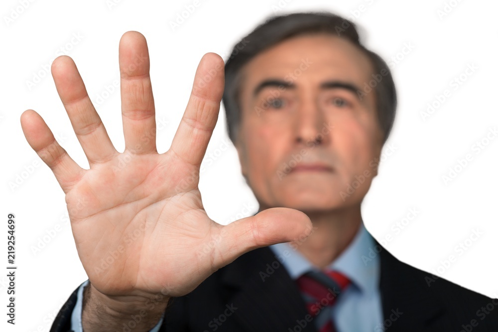 Portrait of a Senior Businessman Showing Hand / Stop Gesture Portrait of a Senior Businessman Showing Hand / Stop Gesture