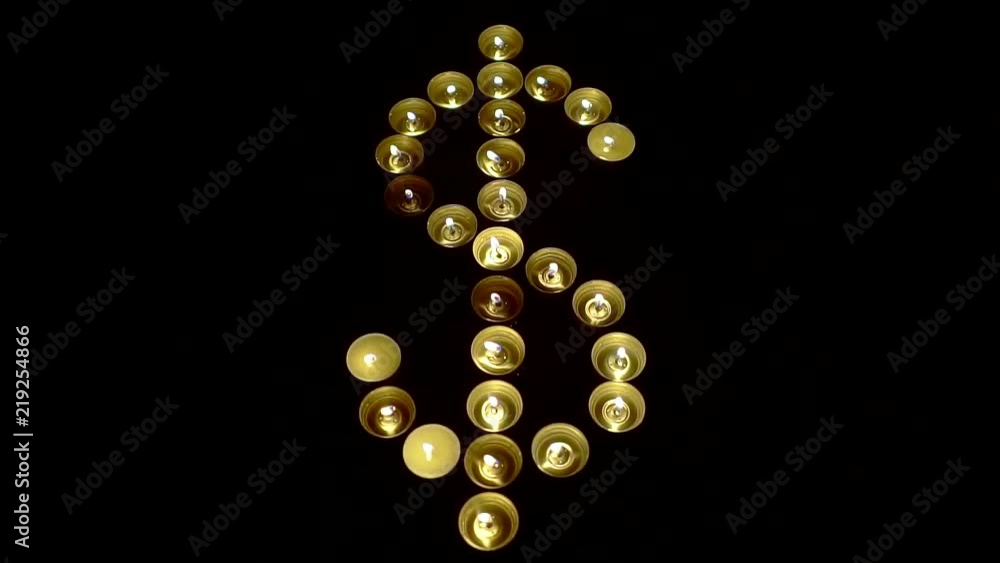 Fire dollar sign. Candles burn warm flame in the shape of a dollar Fire dollar sign. Candles burn warm flame in the shape of a dollar