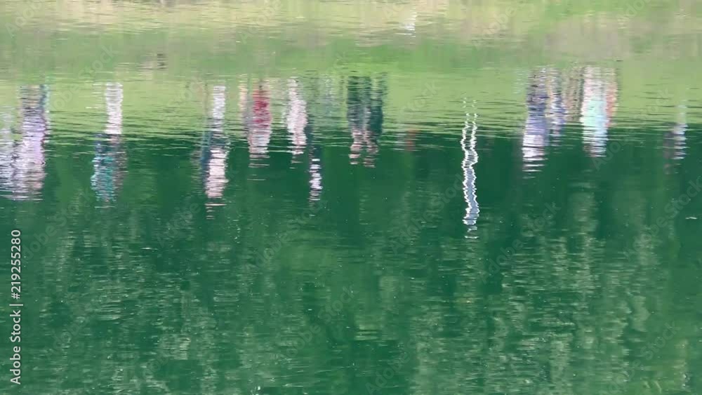 People reflected in the surface of lake, 4K video People reflected in the surface of lake, 4K video