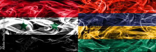 Syria vs Mauritius smoke flags placed side by side. Thick colored silky smoke flags of Syrian and Mauritius