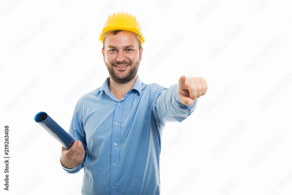 Young architect holding blueprints and pointing finger Young architect holding blueprints and pointing finger