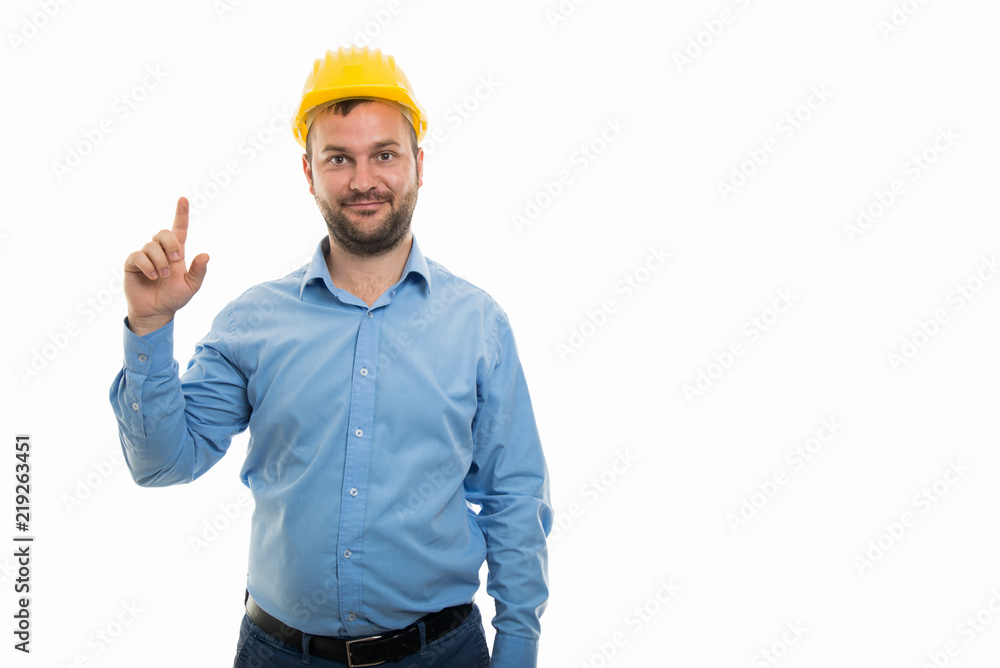 Young architect with yellow helmet showing having idea gesture Young architect with yellow helmet showing having idea gesture
