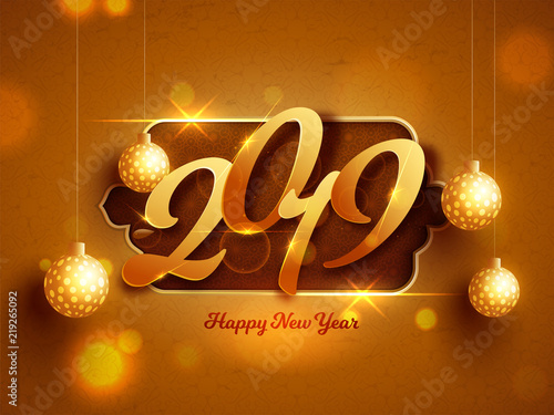 Stylish text 2019 on golden blurred background decorated with hanging christmas ball for New Year celebration. Can be used as greeting card design.
