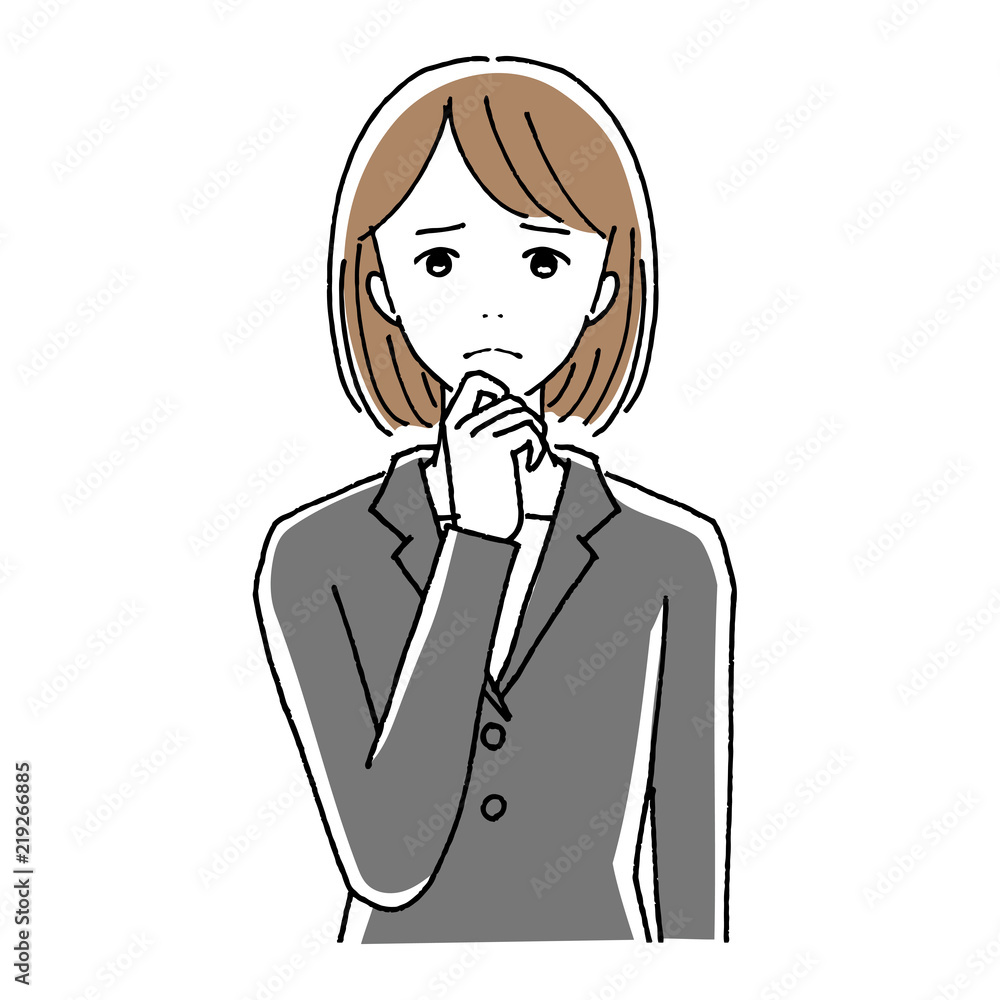 考え事をするスーツの女性
