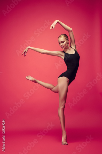 Fototapeta Naklejka Na Ścianę i Meble -  Young teen dancer on red studio background.