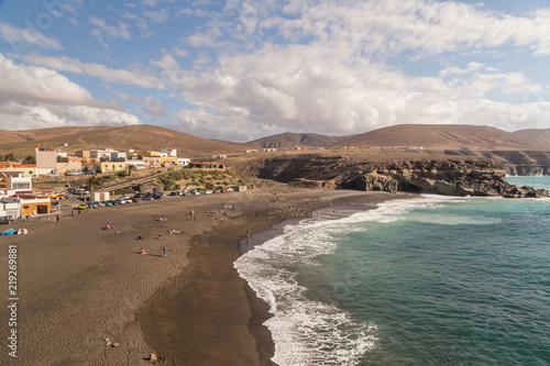 View of sandy beach and village of Ajuy, Fuerteventura, Canary Islands.