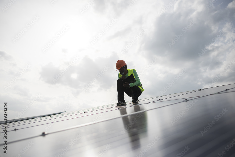 Technician engineer checks the maintenance of the solar cell panels. Technician engineer checks the maintenance of the solar cell panels.