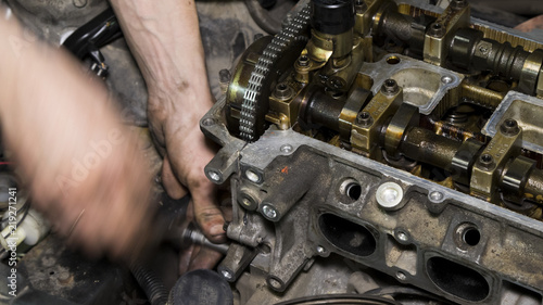 Mechanic repairs the car engine